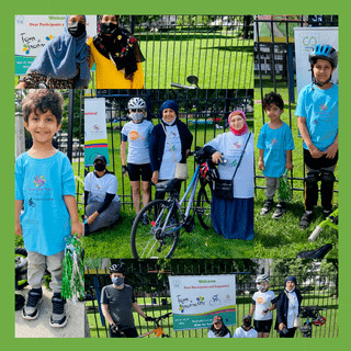 People in blue t-shirts sharing bikes